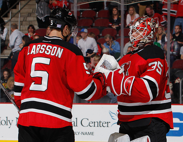 NEWARK, NJ - NOVEMBER 06:  Adam Larsson #5 and goalie Cory Schneider #35 of the New Jersey Devils celebrate their win after an NHL hockey game at Prudential Center on November 6, 2015 in Newark, New Jersey.  Devils won 4-2. (Photo by Paul Bereswill/Getty Images)