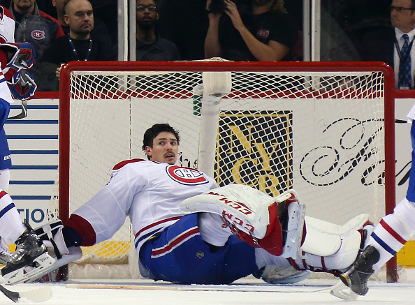 NEW YORK, NY - NOVEMBER 20:  Carey Price #31 of the Montreal Canadiens sits in the crease following a collision with Brock Nelson #29 of the New York Islanders late in the third period at the Barclays Center on November 20, 2015 in the Brooklyn borough of New York City. The Canadiens defeated the Islanders 5-3.  (Photo by Bruce Bennett/Getty Images)