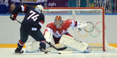 Feb 15, 2014; Sochi, RUSSIA; USA forward T.J. Oshie (74) scores a goal past Russia goalkeeper Sergei Bobrovski (72) in an overtime shootout in a men's preliminary round ice hockey game during the Sochi 2014 Olympic Winter Games at Bolshoy Ice Dome. Mandatory Credit: Jayne Kamin-Oncea-USA TODAY Sports
