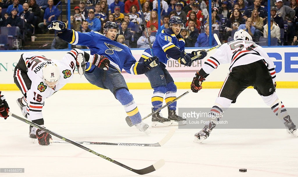 The Chicago Blackhawks' Tervor van Riemsdyk, right, is penalized for hooking the St. Louis Blues' Troy Brouwer in the third period on Wednesay, March 9, 2016, at the Scottrade Center in St. Louis. The Blues won in a shootout, 3-2. (Chris Lee/St. Louis Post-Dispatch/TNS)